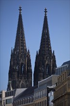 Cologne Cathedral behind the facades of houses in the city centre