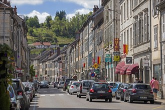 Old houses and shops in main street of the town Salins-les-Bains