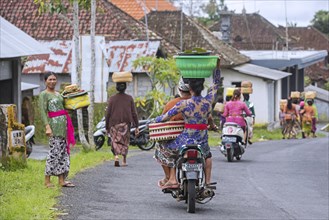 Balinese women transporting goods on their heads near Ubud