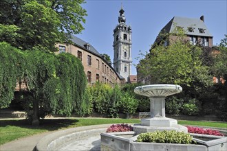 Fountain in park and belfry at Mons