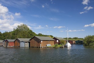 Wooden boat houses on the banks of the Plauer See at Plau am See