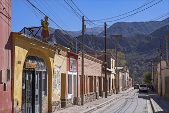 Street with adobe houses and hostel in the town San Francisco de Tilcara
