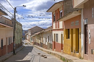 Street with pastel coloured houses in the colonial city Vallegrande