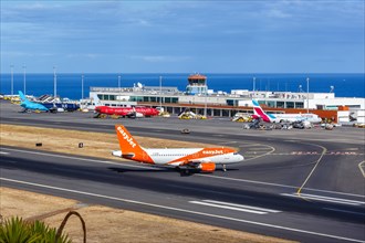 An EasyJet Airbus A319 aircraft with the registration G-EZBX at Funchal Airport