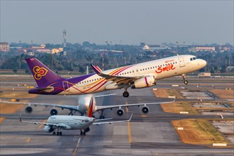 A Thai Smile Airbus A320 aircraft with the registration HS-TXJ at Bangkok Suvarnabhumi Airport