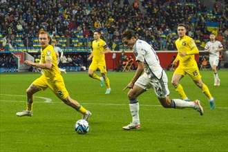 Federico Chiesa Italy right in a duel with Yukhym KONOPLIA Ukraine