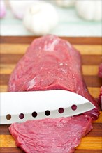 Raw beef cutting on wood board ready to cook