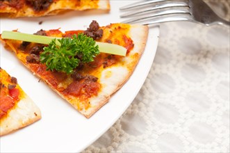 Fresh baked Turkish beef pizza with cucumber on top