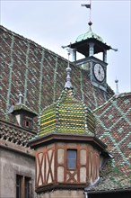 Detail of roof with turret and colorful roof tiles of the old customs office