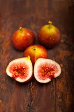 Fresh figs macro closeup over old wood boards