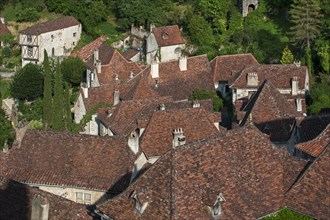 Red tiled roofs of houses at the medieval village Saint-Cirq-Lapopie