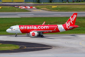 An AirAsia Airbus A320neo aircraft with the registration 9M-AGB at Changi Airport
