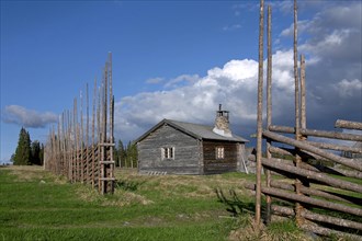 Log cabins of farm with sod roof at Jaemtland