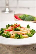 Classic Italian penne pasta with broccoli and red chili pepper