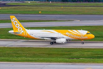 A Scoot Airbus A320 aircraft with the registration 9V-TRD at Changi Airport