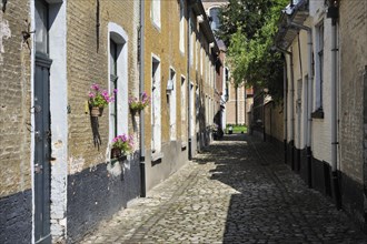 Narrow alleys with old houses of beguines in the beguinage of Lier
