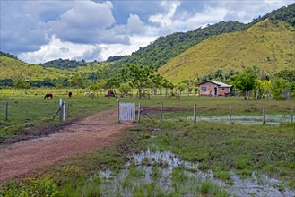 Small farm house on the savanna along the Linden-Lethem dirt road linking Lethem and Georgetown in the rainy season