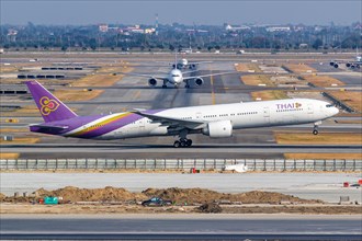 A Thai Airways Boeing 777-300ER aircraft with the registration HS-TKP at Bangkok Suvarnabhumi Airport