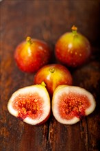 Fresh figs macro closeup over old wood boards