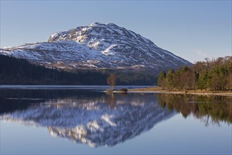 Loch Laggan and snow covered mountain Creag Meagaidh near Dalwhinnie in the Scottish Highlands in winter