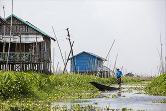 Traditional wooden houses on bamboo stilts in Inle Lake