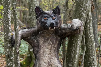 Scary werewolf puppet in forest