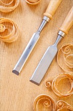 Chisels on wooden boards and shavings