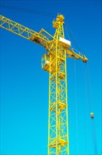 Close-up of a yellow construction crane