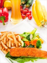 Fresh breaded chicken breast roll and vegetables
