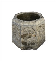 Ancient stone bucket finely carved with iced water over white backgroungd