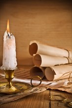 Candle and old paper roll