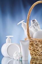 Copy room image of white care products on a blue background