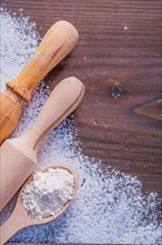 Copyspace image wooden spoon with white natural flour and rolling pin on vintage board food and drink concept