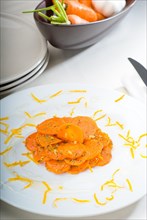 Fresh and healthy Honey glazed carrots on a plate with tyme on top