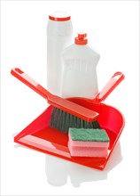 Brush on dustpan with bottles and sponge