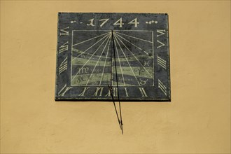 Sundial on a house facade