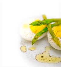 Boiled fresh green asparagus and eggs with extra virgin olive oil