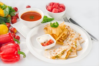 Original Mexican quesadilla de pollo with nachos served with gazpacho soup and watermelon