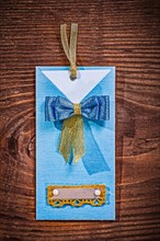 Blue paper invitation envelope on wooden board