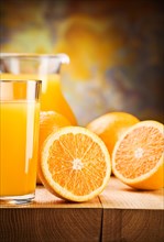 Cut the oranges and pour the juice into a glass
