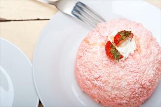 Fresh pink strawberry and whipped cream dessert macro close up