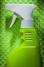 Kitchen sprayer on green dishrag