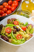 Fresh healthy homemade italian fusilli pasta salad with parmesan cheese