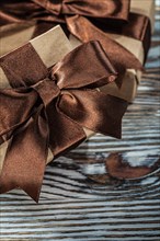 Composition of brown gift boxes on wooden background