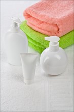 Accessories for bathing on a white towel