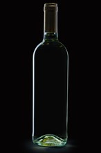 Bottle of white wine on black background