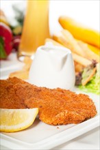 Classic breaded Milanese veal cutlets with french fries