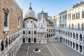 View of the inner courtyard of the Doge's Palace with St Mark's Basilica and giant staircase