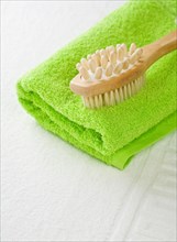 Brush on green towel