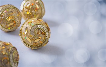 Golden christmas bauble on grey background